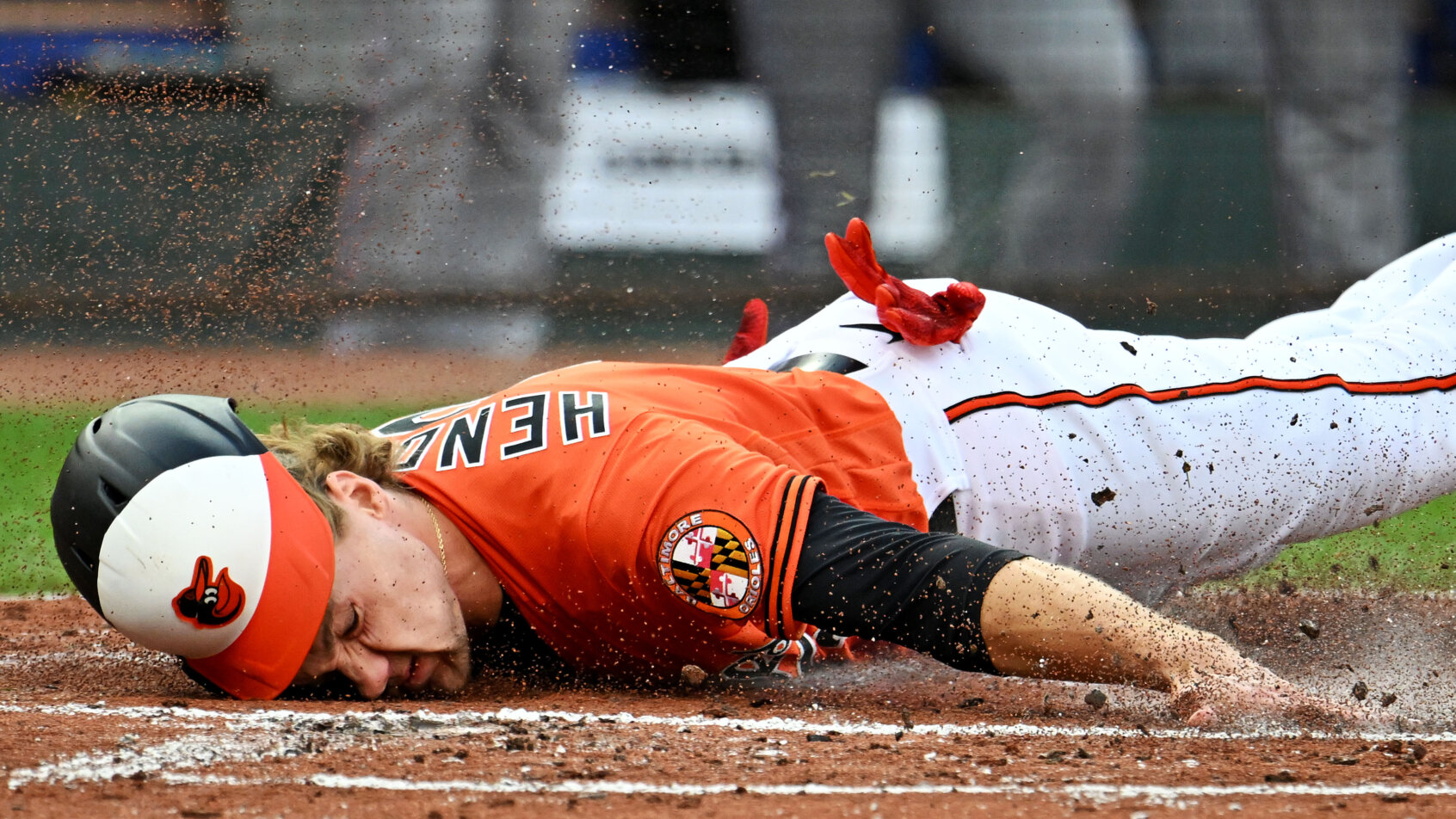 Baltimore Orioles third baseman Gunnar Henderson sliding into home