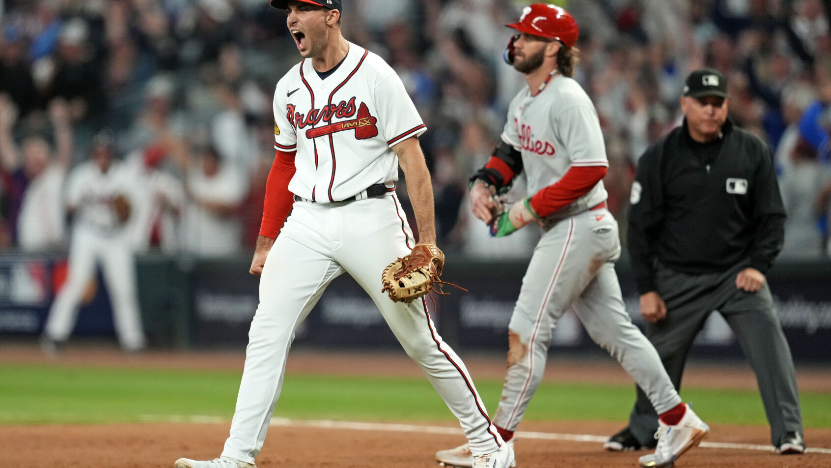 Atlanta Braves third baseman Austin Riley celebrates a win over the Philadelphia Phillies in the 2023 NLDS