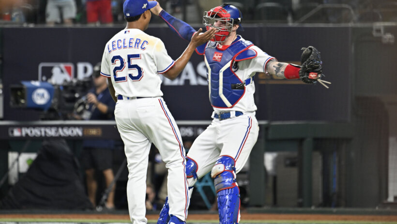 Texas Rangers closer Jose Leclerc celebrates a victory with catcher Jonah Heim