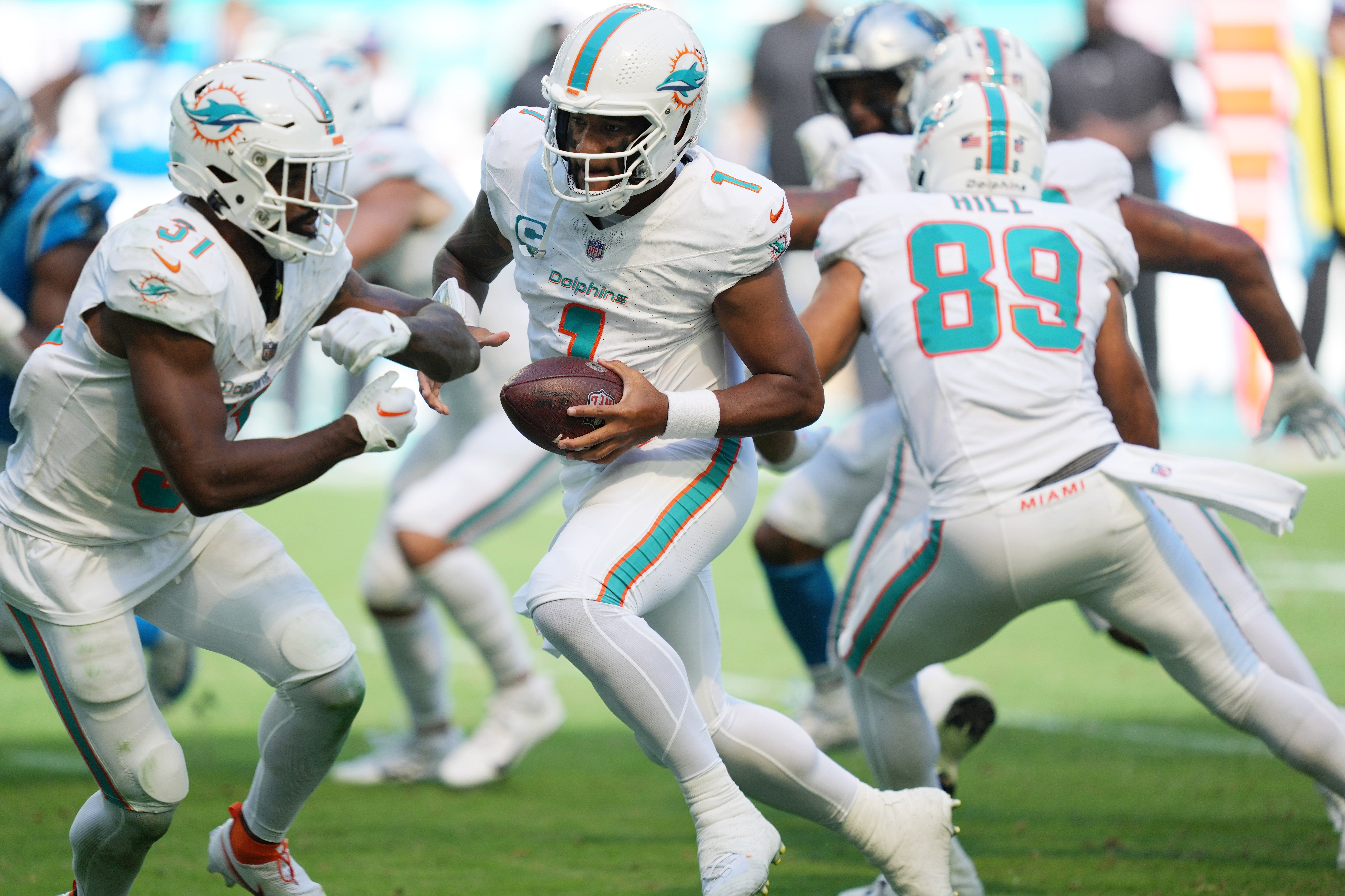 Miami Dolphins quarterback Tua Tagovailoa faking a handoff