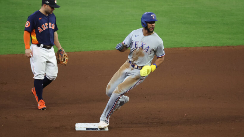 Texas Rangers center fielder Leody Taveras arrives at second base