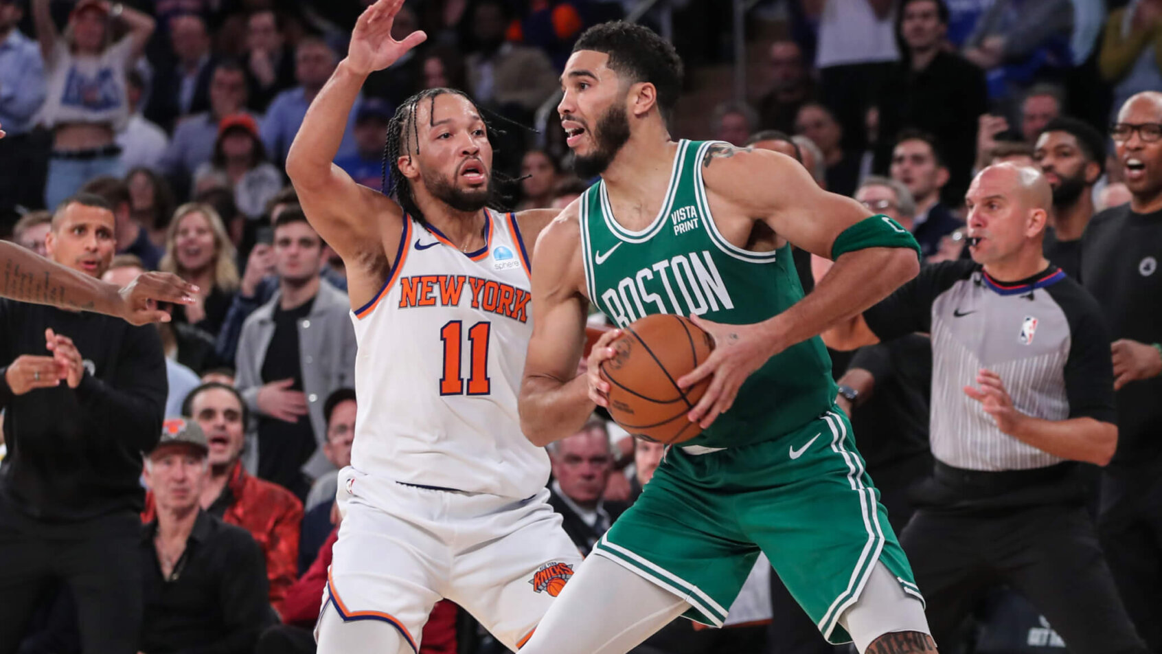 Boston Celtics forward Jayson Tatum is guarded by New York Knicks guard Jalen Brunson