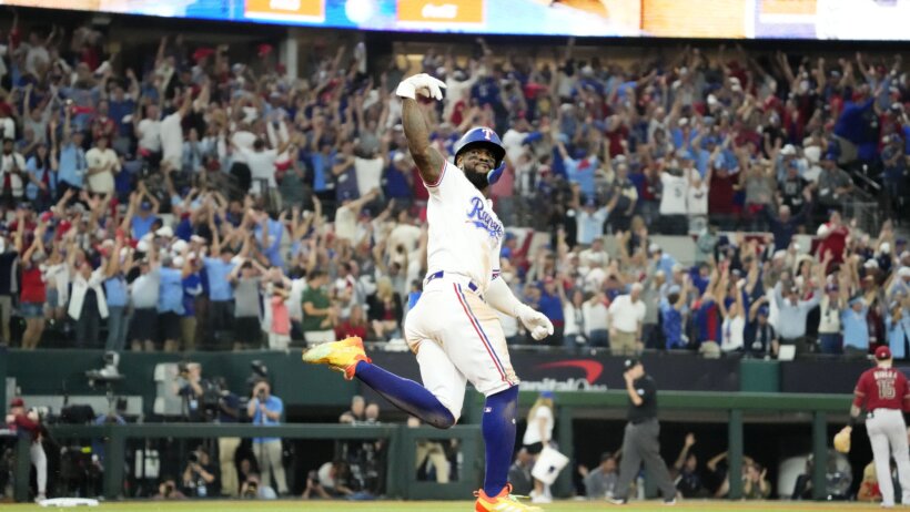 Texas Rangers Adolis Garcia rounding the bases after a walk-off home run