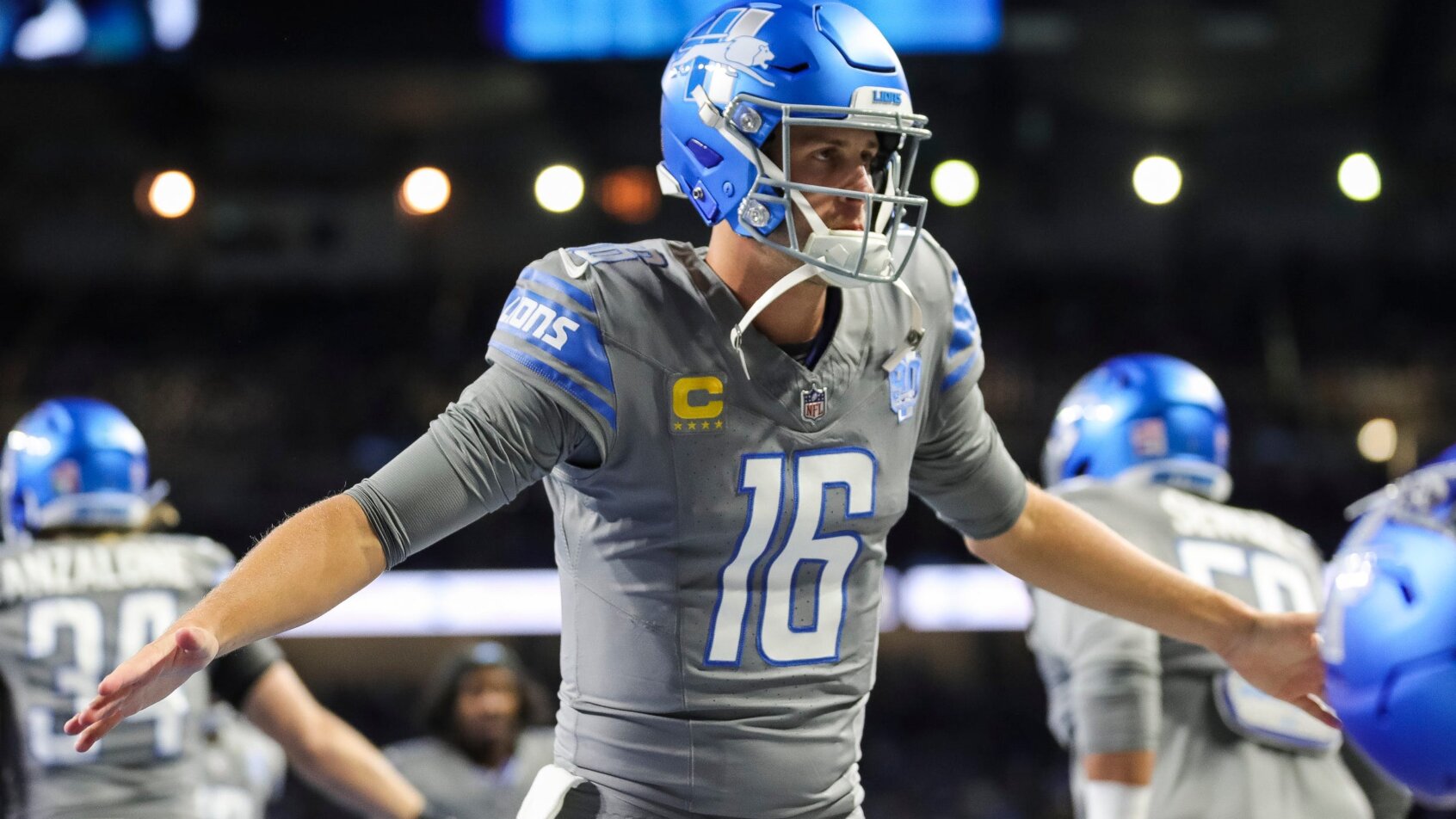 Lions quarterback Jared Goff high-fives teammates