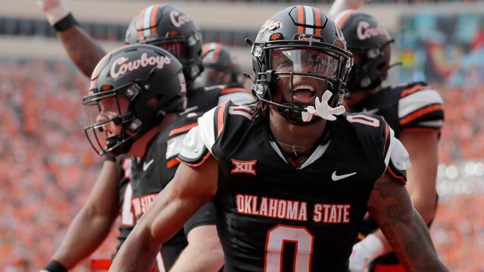 Oklahoma State's Ollie Gordon II celebrates a Alan Bowman touchdown