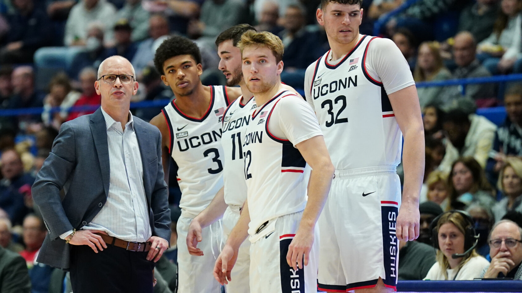 UConn coach Dan Hurley talking to his players on the sideline