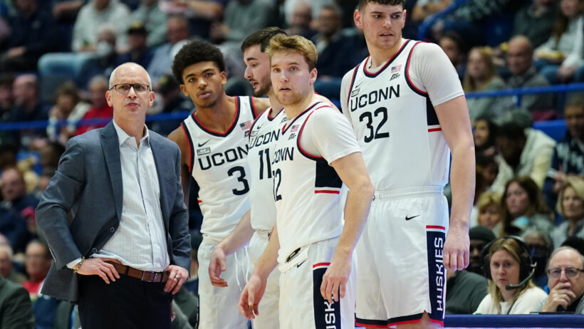UConn coach Dan Hurley talking to his players on the sideline