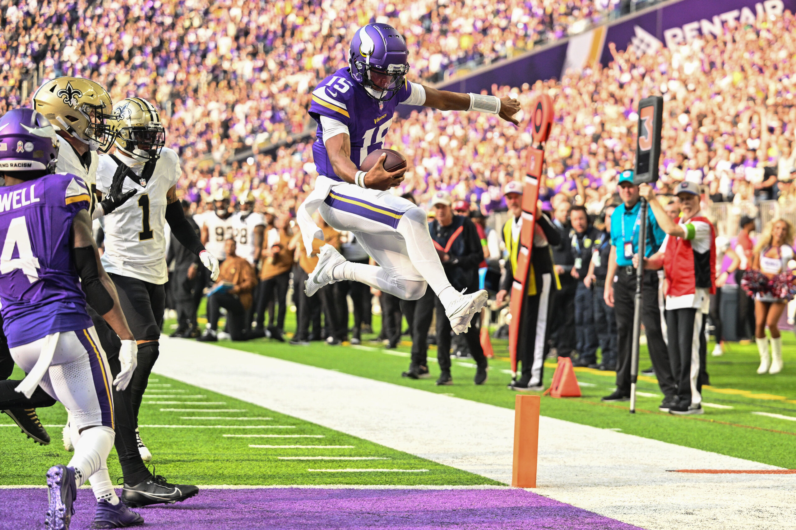 Minnesota Vikings quarterback Joshua Dobbs (15) scores on a touchdown
