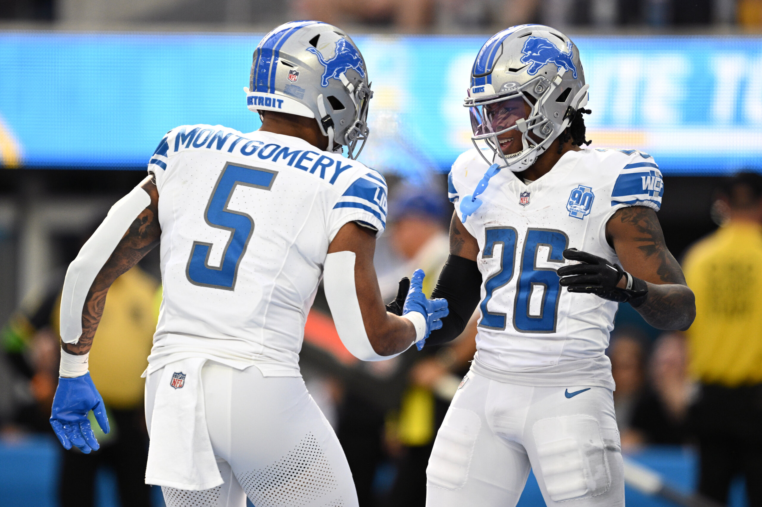 Detroit Lions running back Jahmyr Gibbs (26) celebrates with running back David Montgomery (5) after scoring a touchdown