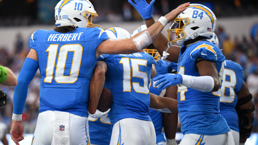 Los Angeles Chargers quarterback Justin Herbert celebrates a TD with tight end Stone Smartt