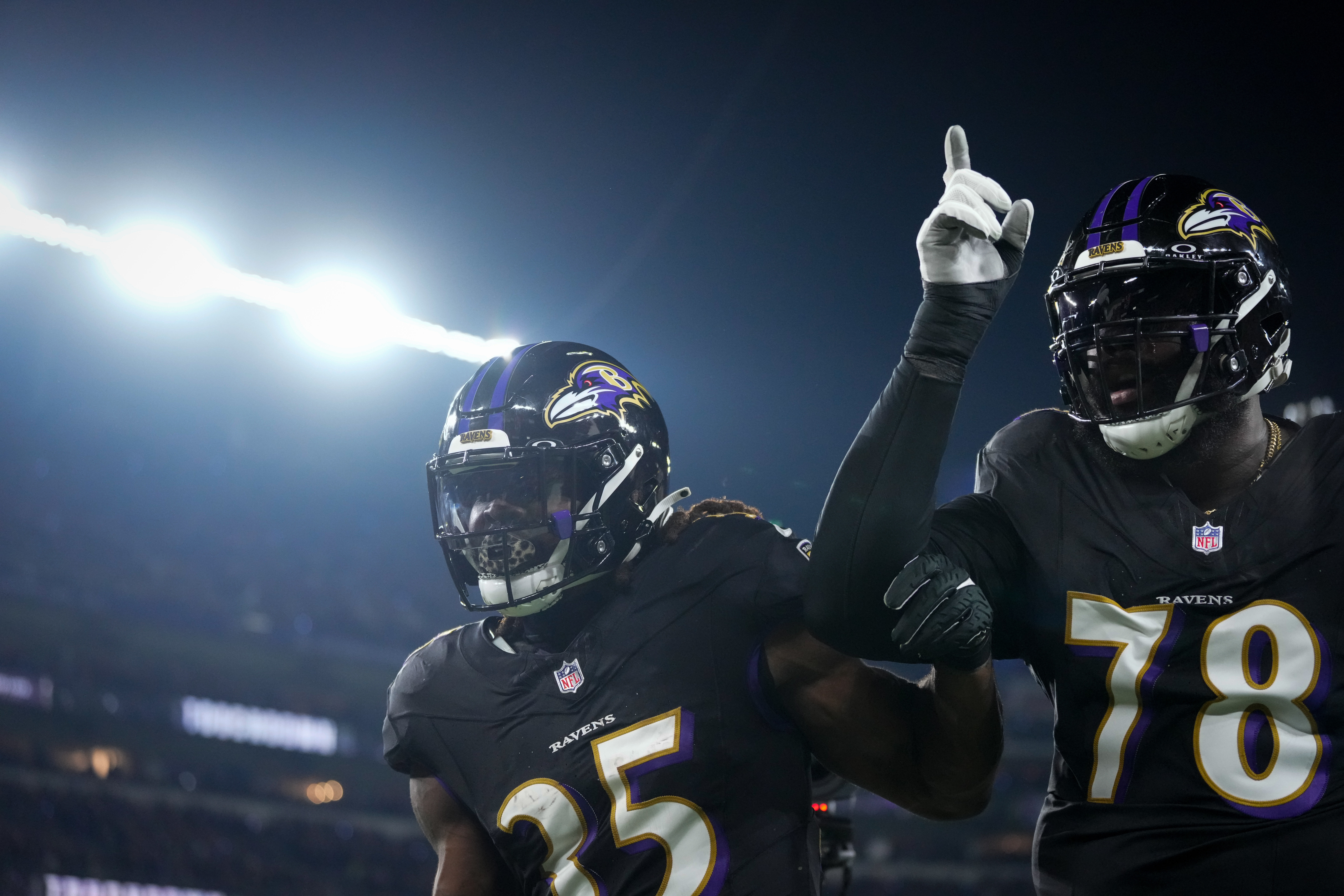 Baltimore Ravens running back Gus Edwards (35) celebrates a touchdown run
