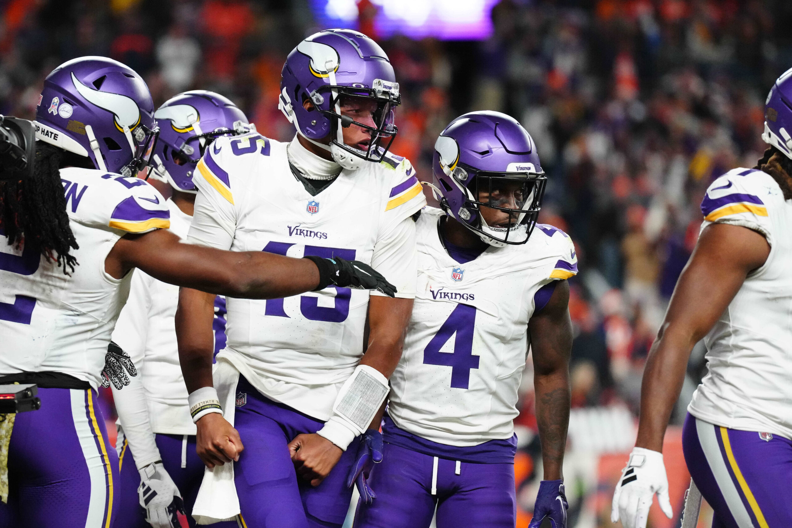 Minnesota Viking quarterback Joshua Dobbs (15) reacts after scoring a touchdown against the Denver Broncos