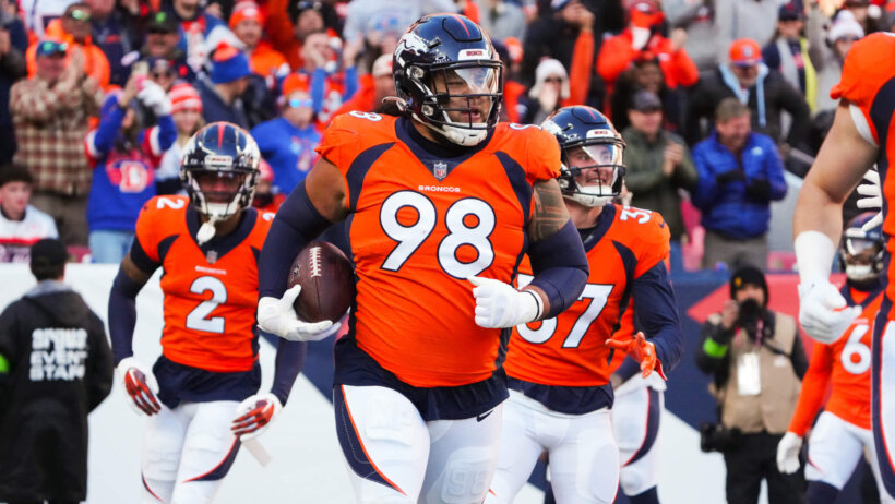 Denver Broncos defensive tackle Mike Purcell (98) following a defensive stop