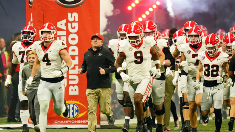 Georgia Bulldogs running out of a tunnel