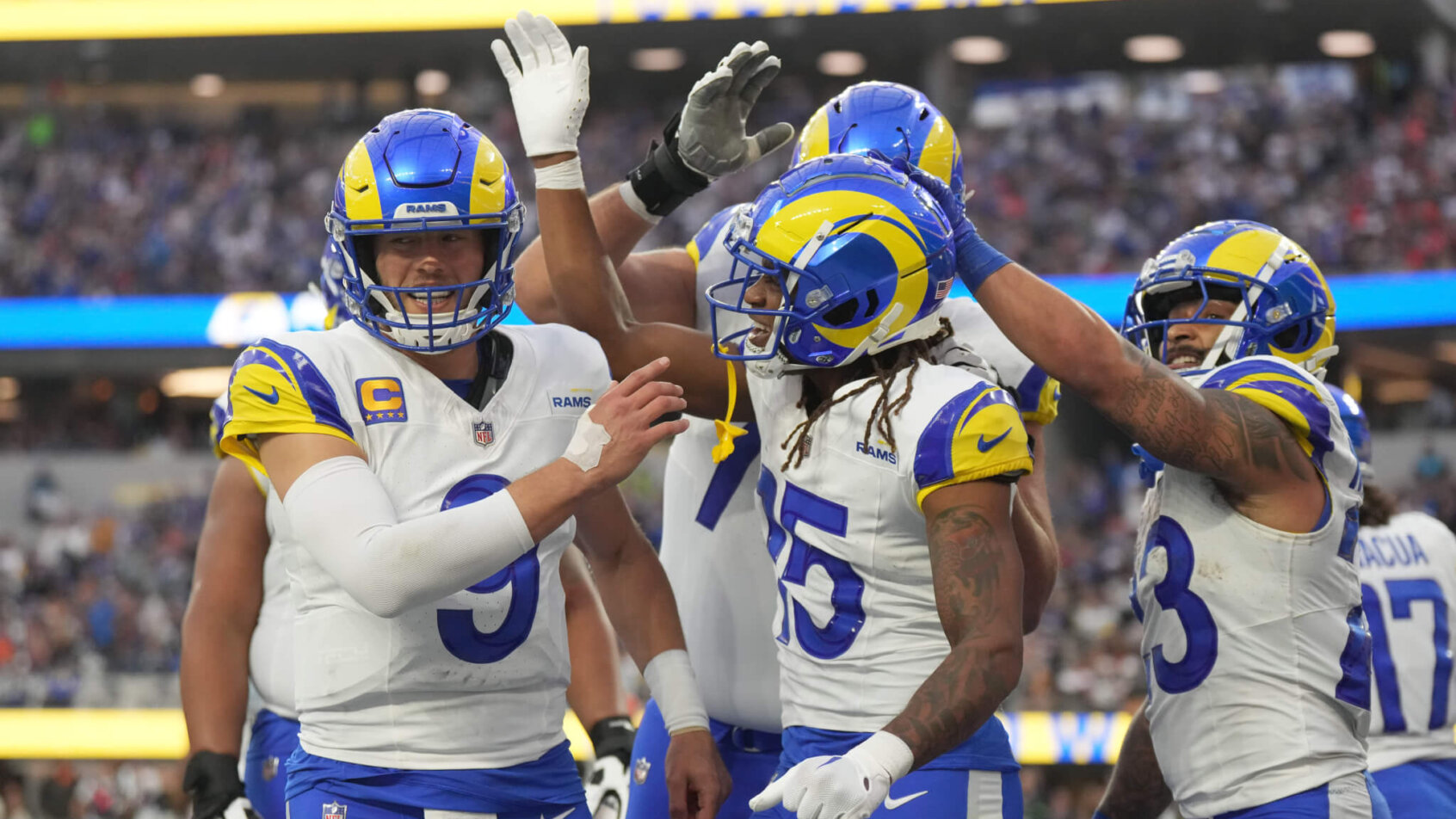 Los Angeles Rams wide receiver Demarcus Robinson (15) celebrates with quarterback Matthew Stafford (9) and running back Kyren Williams (23)
