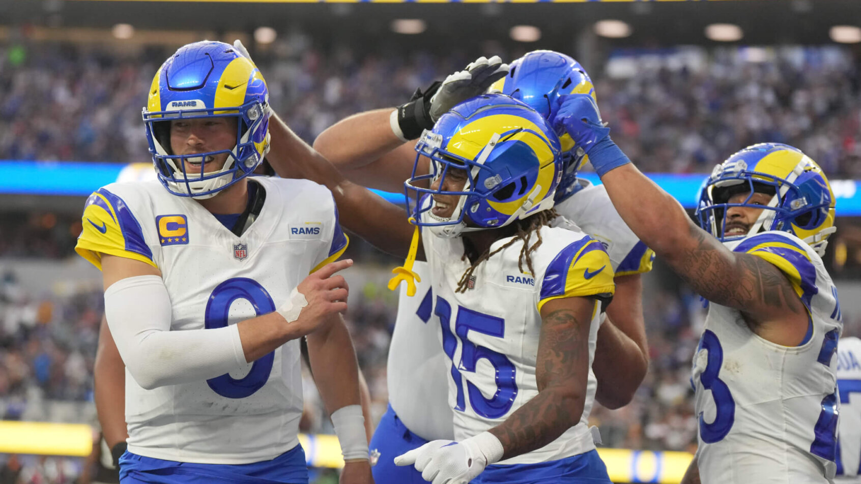 Los Angeles Rams wide receiver Demarcus Robinson (15) celebrates with quarterback Matthew Stafford (9) and running back Kyren Williams (23)
