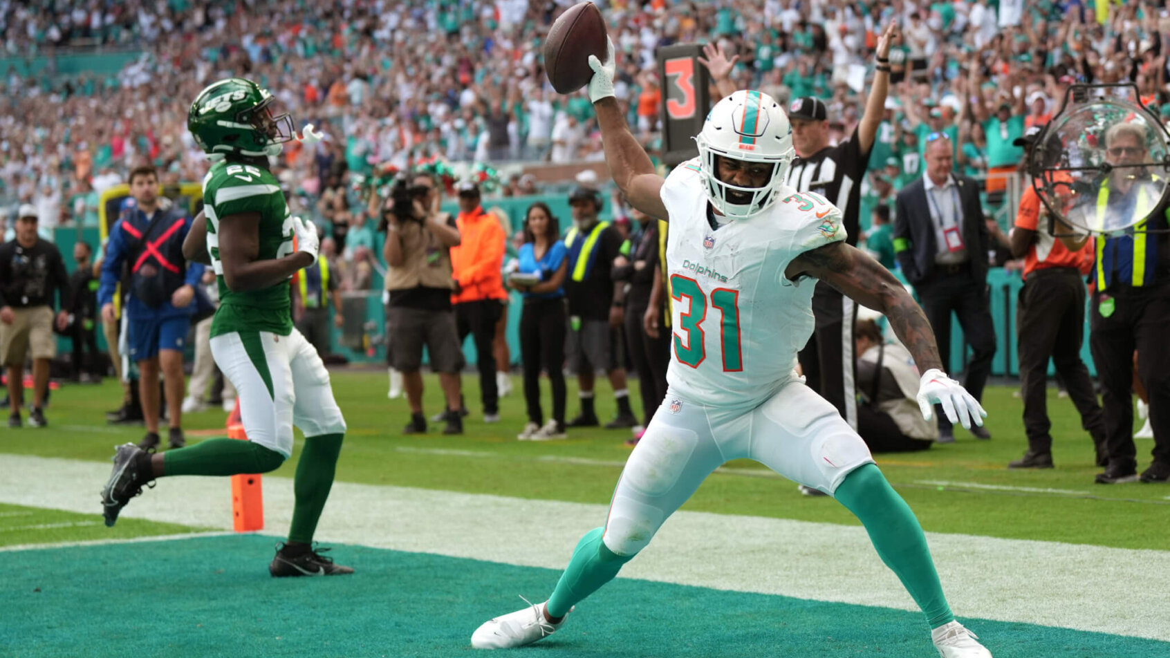 Miami Dolphins running back Raheem Mostert (31) spikes the ball after scoring a touchdown