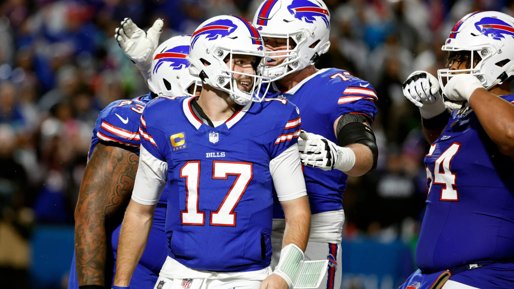 Josh Allen (17) celebrates his 1-yard touchdown run against the Cowboys.