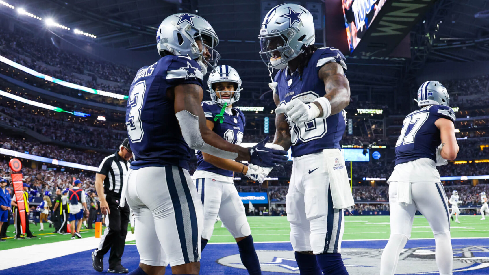 Dallas Cowboys wide receiver Brandin Cooks (3) celebrates with Dallas Cowboys wide receiver CeeDee Lamb (88) after making a touchdown catch