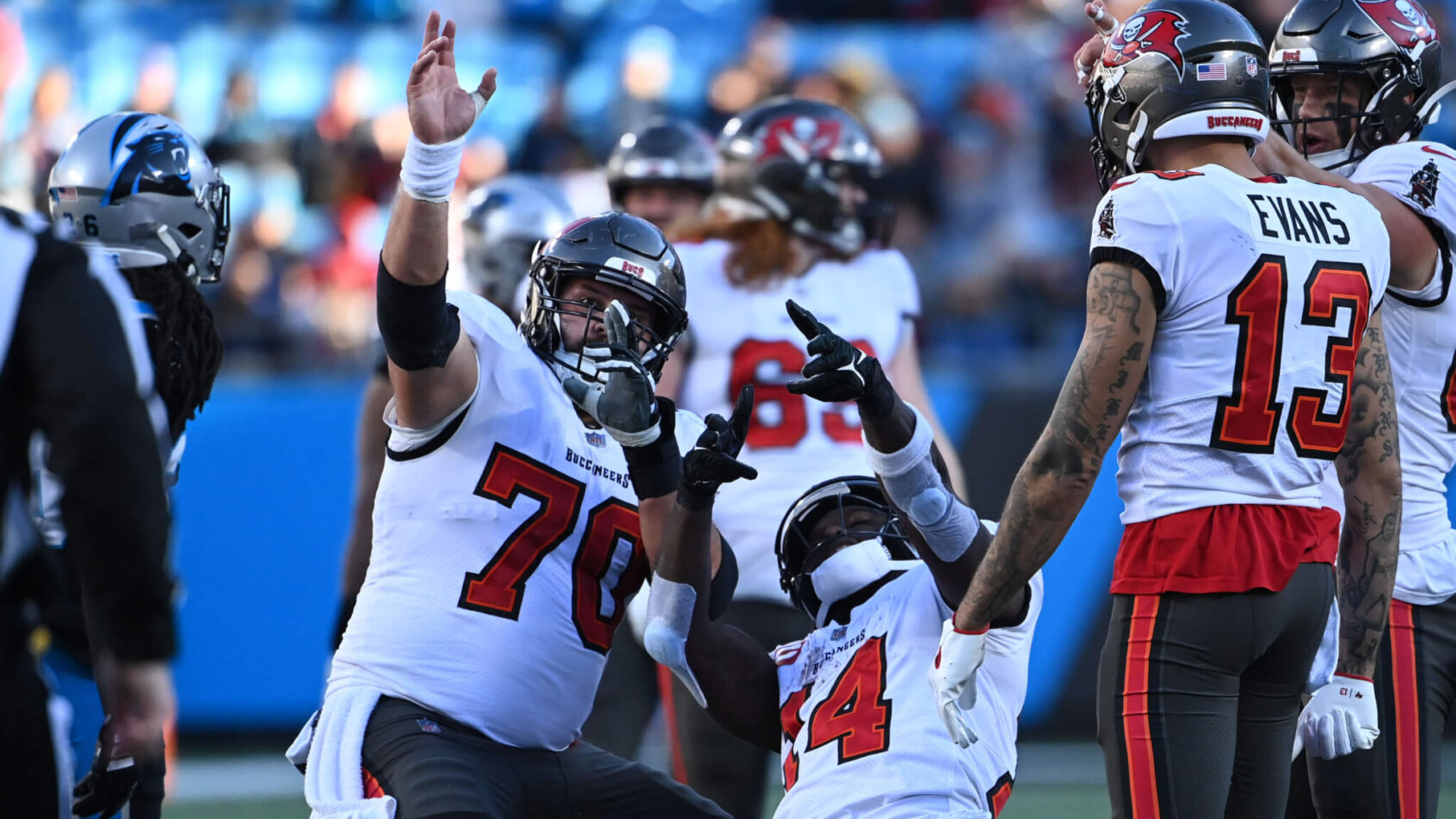 Tampa Bay Buccaneers center Robert Hainsey (70) and wide receiver Chris Godwin (14) signal a first down i