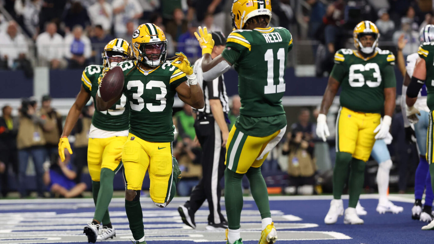 Green Bay Packers running back Aaron Jones (33) reacts after scoring a touchdown against the Dallas Cowboys