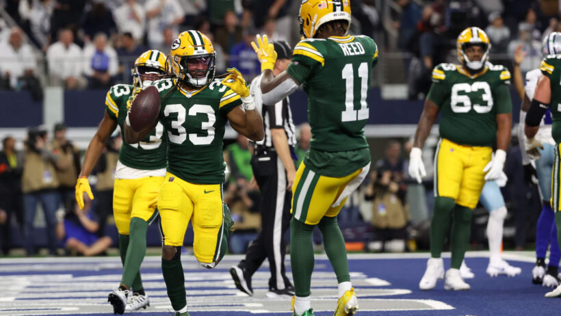 Green Bay Packers running back Aaron Jones (33) reacts after scoring a touchdown against the Dallas Cowboys