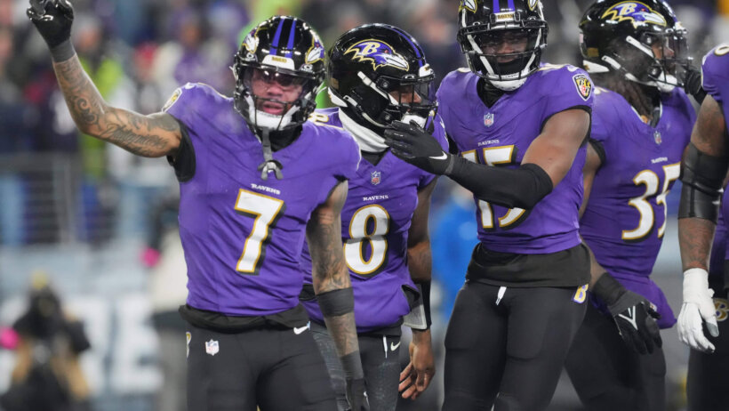 Baltimore Ravens quarterback Lamar Jackson (8) celebrates with wide receiver Rashod Bateman (7) and wide receiver Nelson Agholor (15) after scoring a touchdown