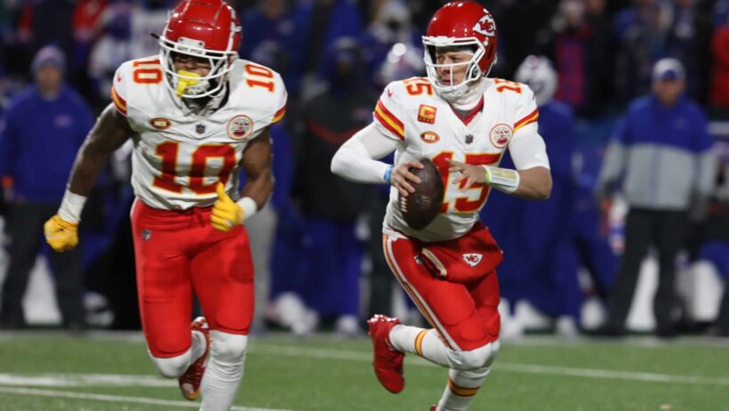 Kansas City Chiefs Isiah Pacheco keeps tries to screen Patrick Mahomes while Mahomes looks for an open receiver.
