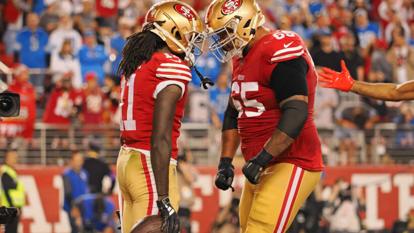 San Francisco 49ers wide receiver Brandon Aiyuk (11) celebrates with guard Aaron Banks (65) after scoring a touchdown
