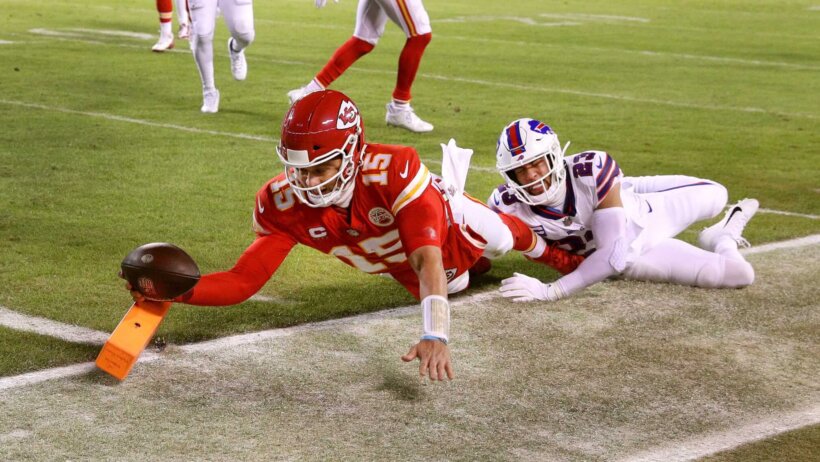 Chiefs quarterback Patrick Mahomes dives into the end zone for an 8-yard touchdown