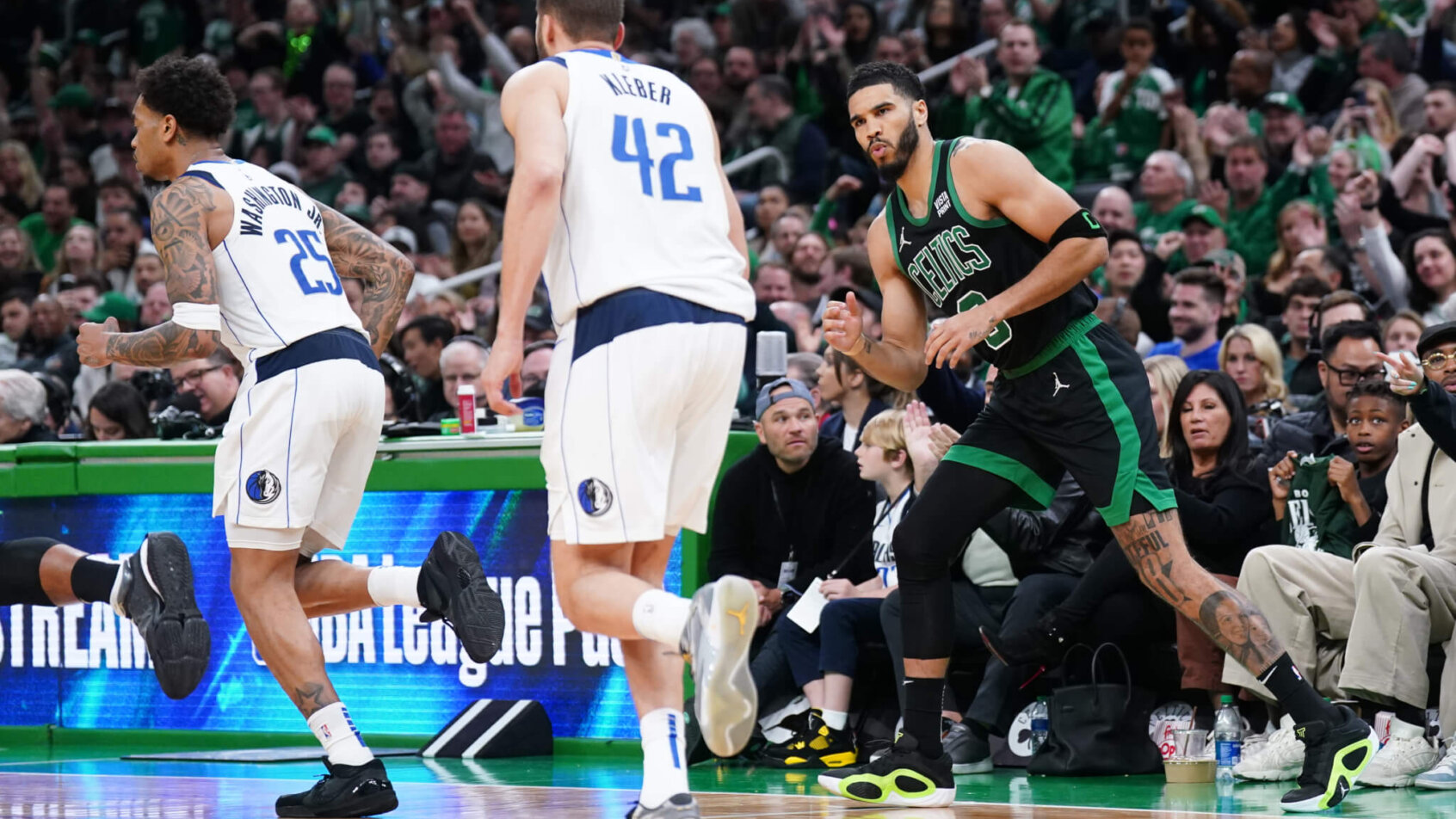 Boston Celtics forward Jayson Tatum reacts after making a basket against the Dallas Mavericks