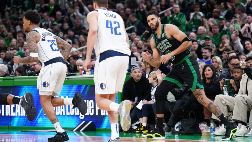 Boston Celtics forward Jayson Tatum reacts after making a basket against the Dallas Mavericks