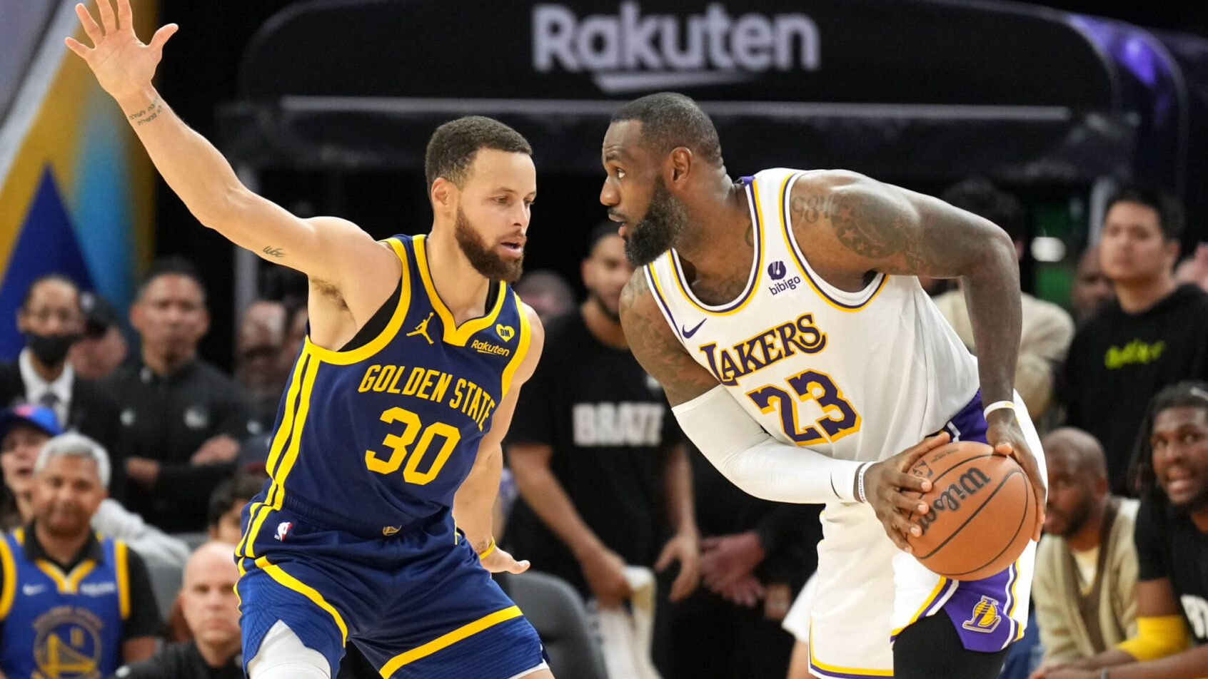 Los Angeles Lakers forward LeBron James handles the ball against Golden State Warriors guard Stephen Curry