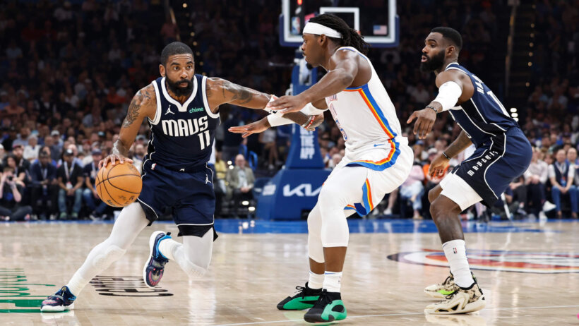 Dallas Mavericks guard Kyrie Irving tries to dribble past Oklahoma City Thunder guard Luguentz Dort