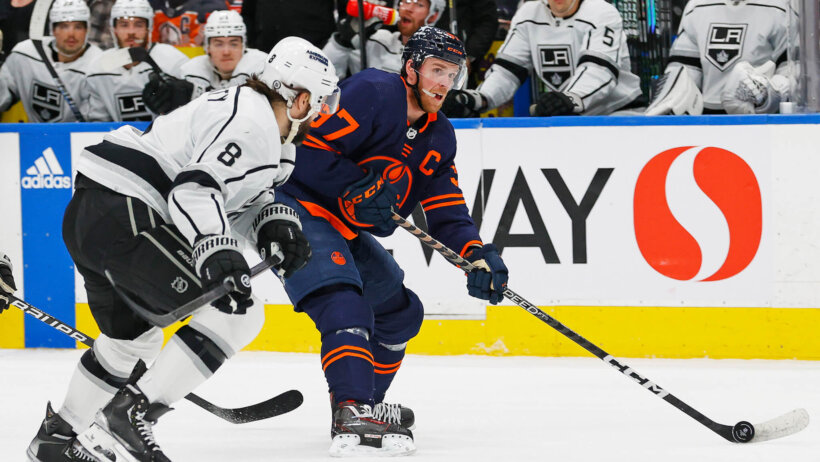 Edmonton Oilers forward Connor McDavid (97) looks to make a pass in front of Los Angeles Kings defensemen Drew Doughty (8) during the first period at Rogers Place.