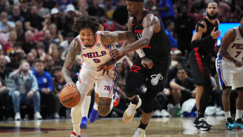 Philadelphia 76ers guard Kelly Oubre Jr dribbles up the court while Miami Heat forward Jimmy Butler defends