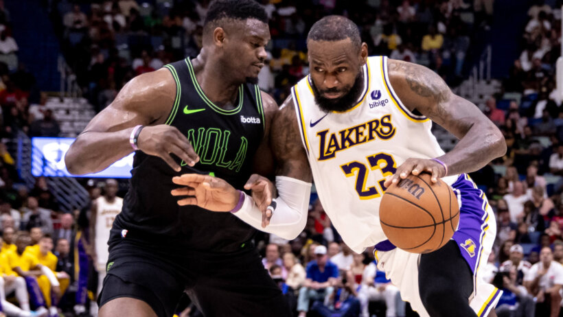 Los Angeles Lakers forward LeBron James tries to drive past New Orleans Pelicans forward Zion Williamson