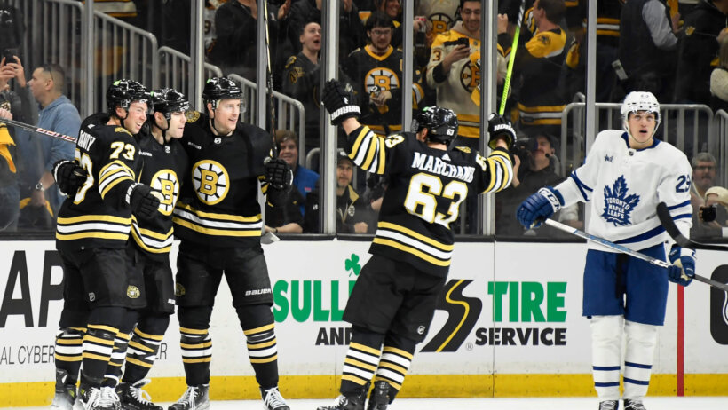 Boston Bruins left wing Jake DeBrusk celebrates his goal with his teammates against Leafs