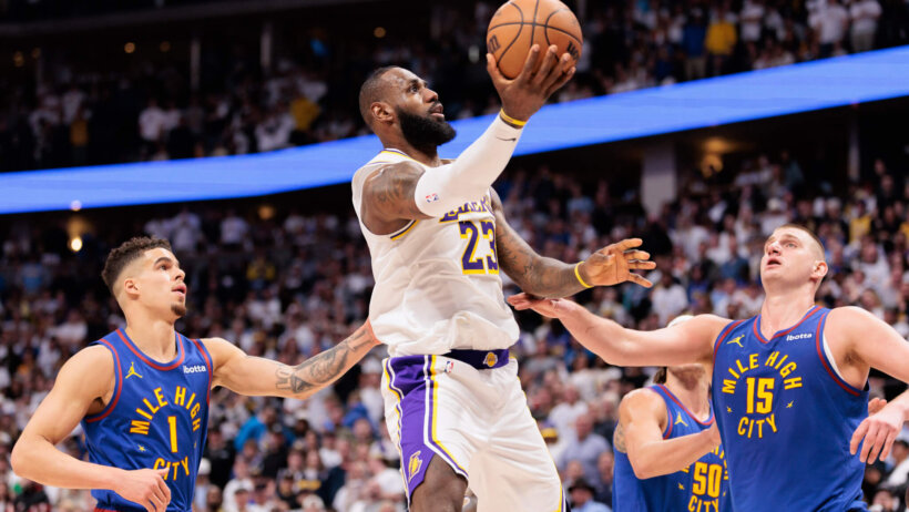 Los Angeles Lakers forward LeBron James goes for a layup against the Denver Nuggets