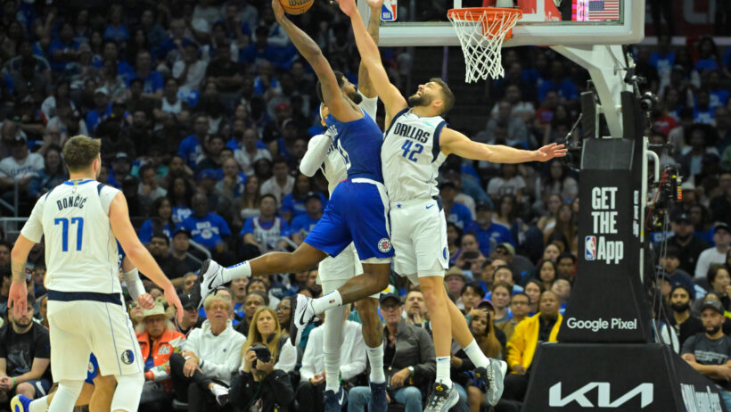 Dallas Mavericks forward Maxi Kleber blocking a dunk attempt by Los Angeles Clippers forward Paul George