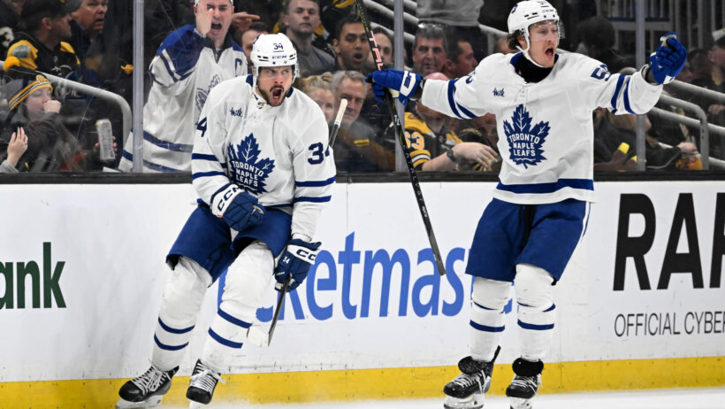 Toronto Maple Leafs center Auston Matthews reacts with left wing Tyler Bertuzzi after scoring a goal against the Boston Bruins