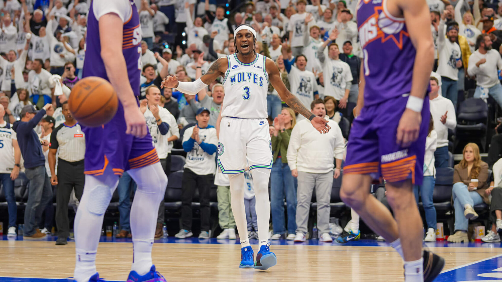 Minnesota Timberwolves forward Jaden McDaniels smiles after scoring a basket