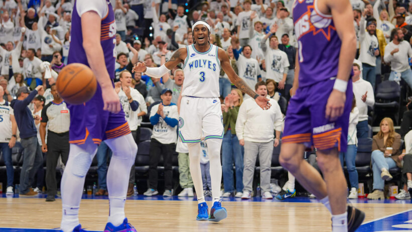 Minnesota Timberwolves forward Jaden McDaniels smiles after scoring a basket
