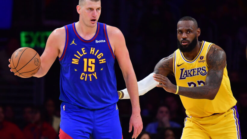 Denver Nuggets center Nikola Jokic controls the ball against Los Angeles Lakers forward LeBron James
