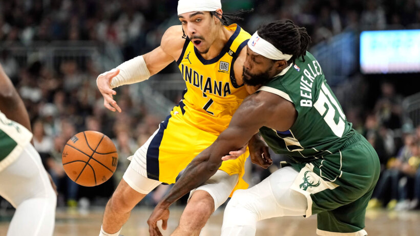 Milwaukee Bucks guard Patrick Beverley pokes the ball away from Indiana Pacers guard Andrew Nembhard