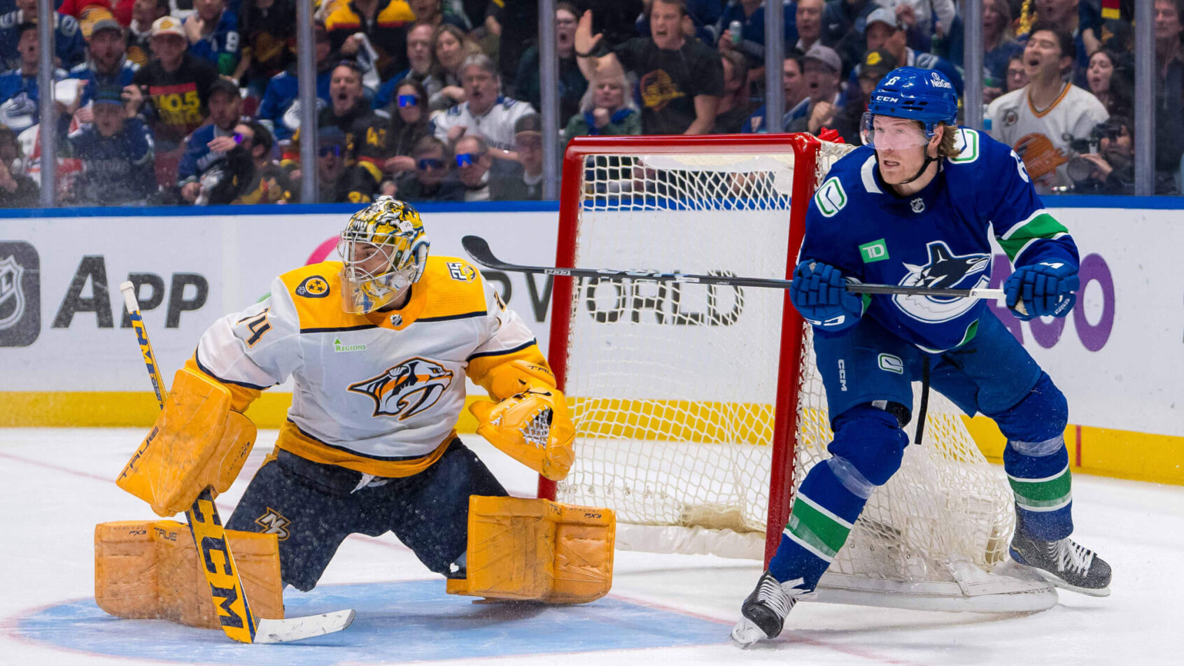 Nashville Predators goalie Juuse Saros and Vancouver Canucks forward Brock Boeser
