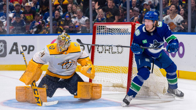 Nashville Predators goalie Juuse Saros and Vancouver Canucks forward Brock Boeser