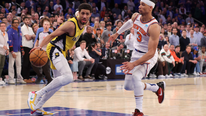 Indiana Pacers guard Tyrese Haliburton controls the ball as New York Knicks guard Josh Hart defends