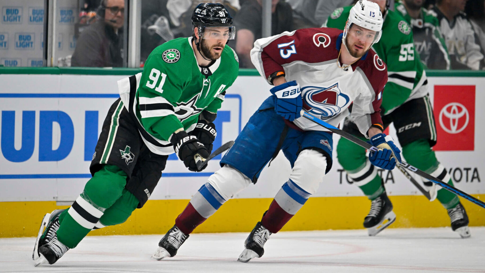 Dallas Stars center Tyler Seguin (91) and Colorado Avalanche right wing Valeri Nichushkin look for the puck at center ice during the first period in game one of the second round of the 2024 Stanley Cup Playoffs at American Airlines Center