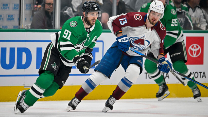 Dallas Stars center Tyler Seguin (91) and Colorado Avalanche right wing Valeri Nichushkin look for the puck at center ice during the first period in game one of the second round of the 2024 Stanley Cup Playoffs at American Airlines Center